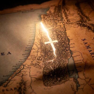 Ancient map of Israel showing glowing light path from Jerusalem to Samaria with cross overlay (Acts 8 sermon)